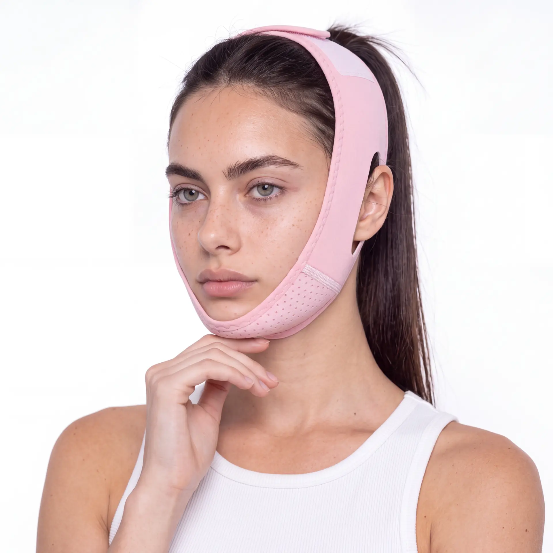 Model wearing the JawSnap blush pink V-line lifting strap